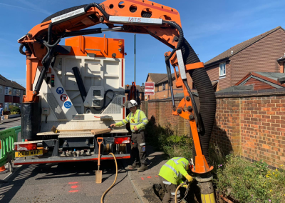 Workers operating our vacuum excavation equipment rental